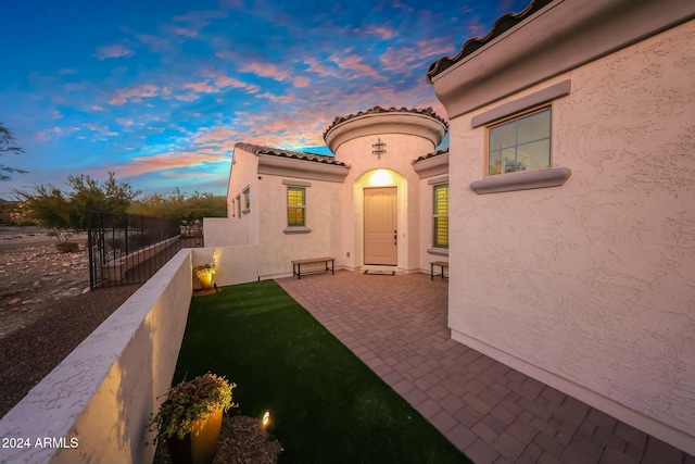 20594 W Pasadena Ave, Buckeye, AZ 85396 - patio terrace at dusk featuring a patio area