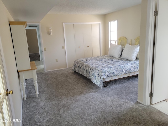 carpeted bedroom featuring a closet