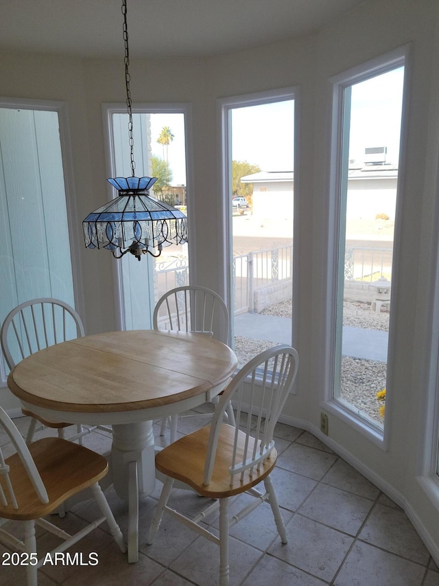 dining room with light tile patterned flooring