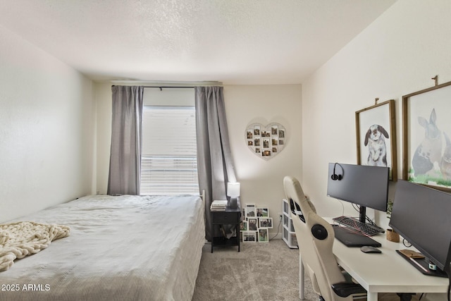 carpeted bedroom featuring a textured ceiling