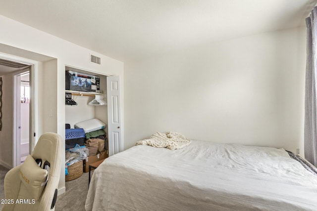 bedroom with carpet and a closet