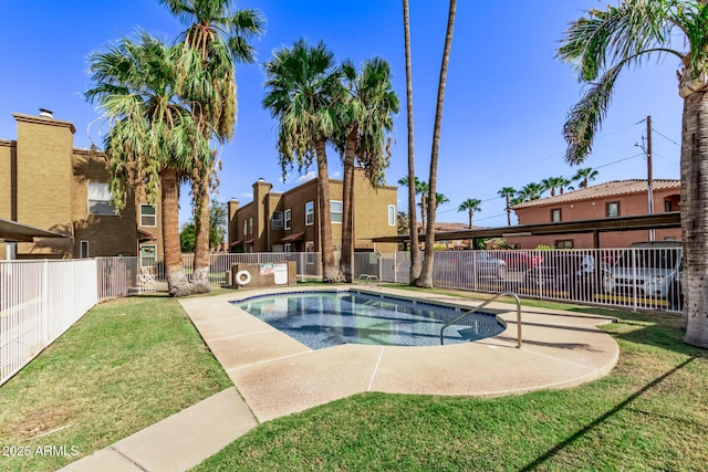 view of pool featuring a yard