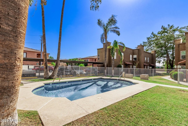 view of swimming pool featuring a lawn