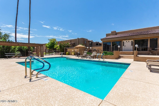 view of pool with a patio area and a pergola