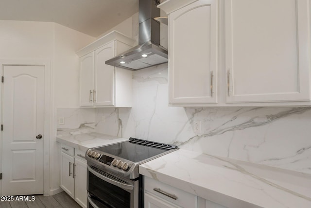 694 W Desert Seasons Dr, San Tan Valley, AZ 85143 - kitchen with wall chimney exhaust hood, electric range, tasteful backsplash, and white cabinetry