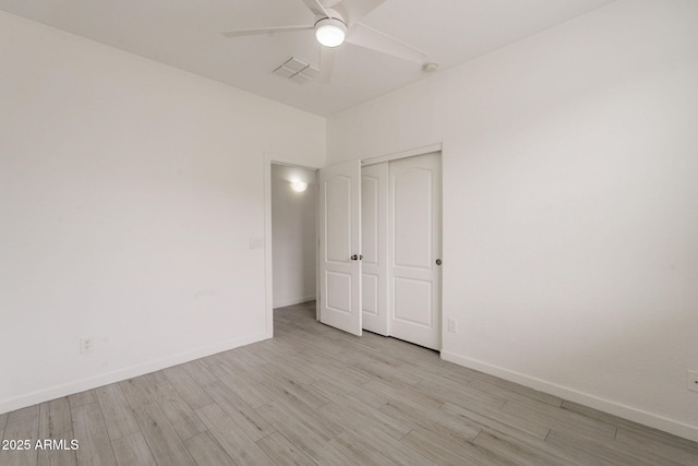 694 W Desert Seasons Dr, San Tan Valley, AZ 85143 - unfurnished bedroom with light wood-type flooring, a closet, and a ceiling fan
