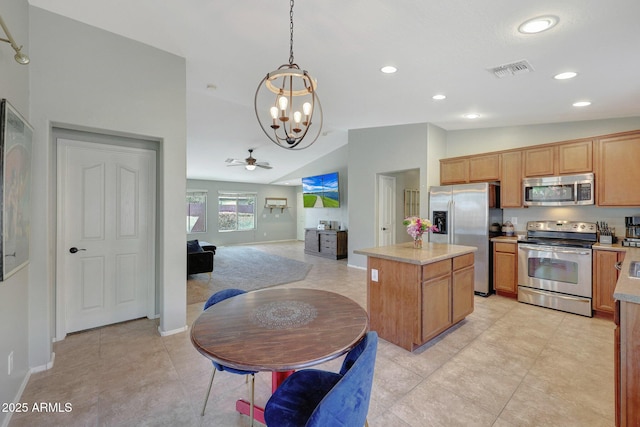 18590 W Vogel Ave, Goodyear, AZ 85338 - kitchen featuring visible vents, light countertops, appliances with stainless steel finishes, vaulted ceiling, and a kitchen island
