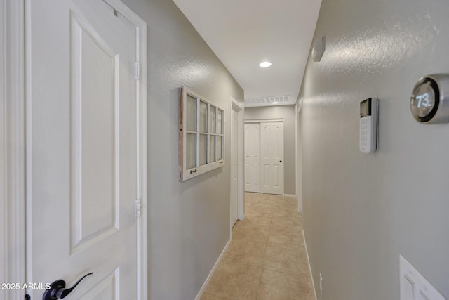 18590 W Vogel Ave, Goodyear, AZ 85338 - hall with light tile patterned floors, baseboards, recessed lighting, and visible vents