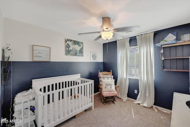 18590 W Vogel Ave, Goodyear, AZ 85338 - bedroom with a nursery area, ceiling fan, carpet, and baseboards