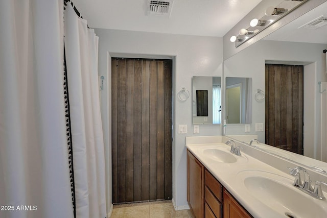 18590 W Vogel Ave, Goodyear, AZ 85338 - full bathroom featuring double vanity, a sink, and visible vents
