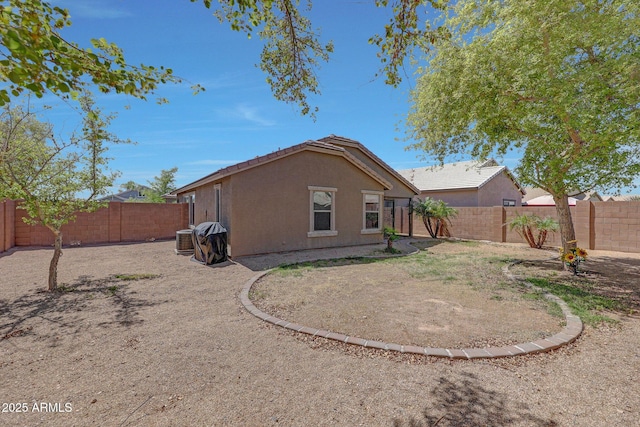 18590 W Vogel Ave, Goodyear, AZ 85338 - rear view of property with a tiled roof, a fenced backyard, and stucco siding
