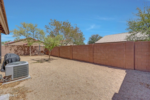 18590 W Vogel Ave, Goodyear, AZ 85338 - view of yard featuring a fenced backyard and central AC unit