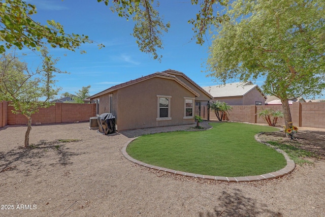 18590 W Vogel Ave, Goodyear, AZ 85338 - rear view of house with a yard, stucco siding, and a fenced backyard