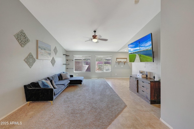 18590 W Vogel Ave, Goodyear, AZ 85338 - living room featuring light tile patterned floors, baseboards, a ceiling fan, and lofted ceiling