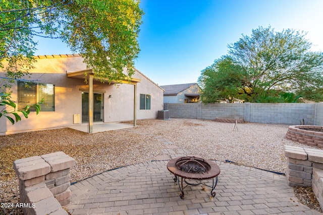 view of patio with an outdoor fire pit and a fenced backyard