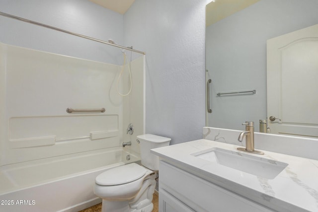 bathroom with toilet, shower / bathing tub combination, and vanity