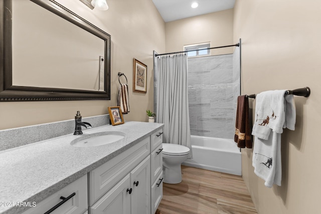 full bathroom featuring shower / bath combination with curtain, vanity, and toilet