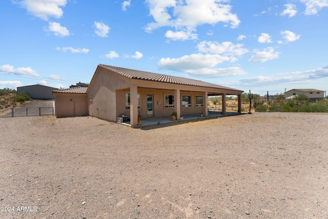 back of property featuring a patio area