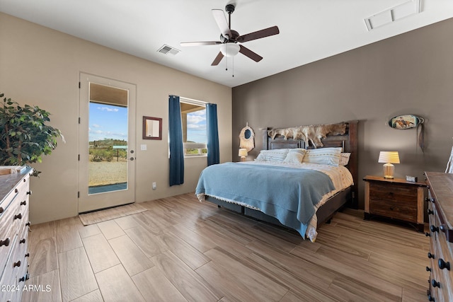 bedroom featuring access to exterior and ceiling fan