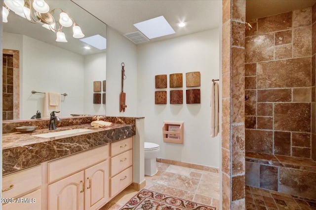 18738 E Buckskin Dr, Rio Verde, AZ 85263 - full bath with toilet, a tile shower, stone tile floors, vanity, and baseboards