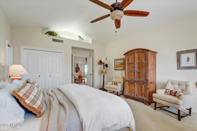 18738 E Buckskin Dr, Rio Verde, AZ 85263 - bedroom featuring a closet, vaulted ceiling, light colored carpet, and a ceiling fan