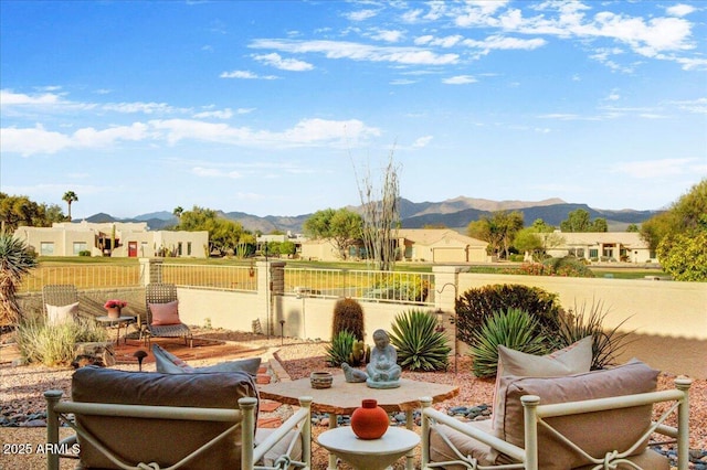 18738 E Buckskin Dr, Rio Verde, AZ 85263 - view of patio featuring a mountain view, a fenced backyard, an outdoor hangout area, and a residential view