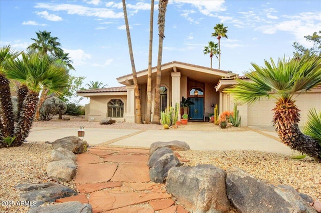 18738 E Buckskin Dr, Rio Verde, AZ 85263 - view of front of property featuring driveway, stucco siding, and an attached garage