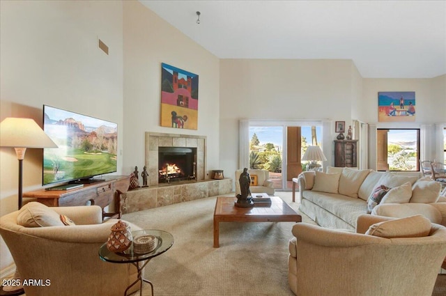 18738 E Buckskin Dr, Rio Verde, AZ 85263 - living area with carpet floors, a high ceiling, and a tile fireplace