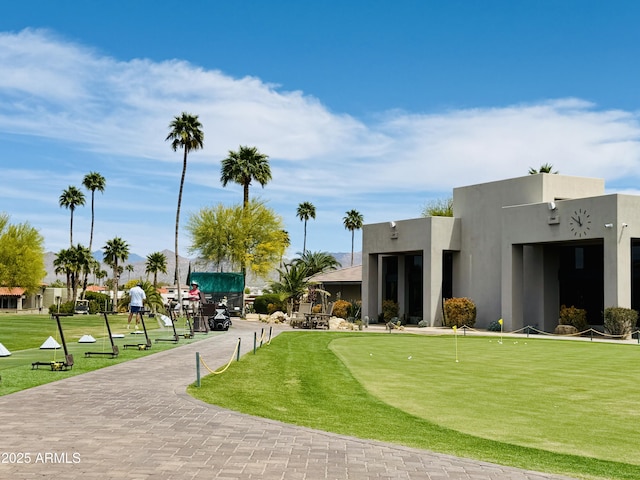 18738 E Buckskin Dr, Rio Verde, AZ 85263 - view of home's community with an area to practice putting and a lawn