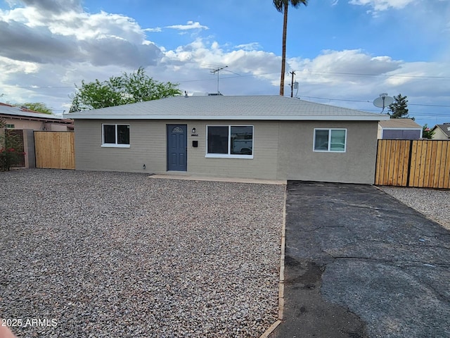 view of front of house featuring fence