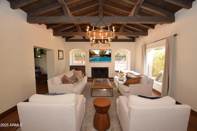 living room with beam ceiling, wooden ceiling, high vaulted ceiling, a notable chandelier, and wood-type flooring