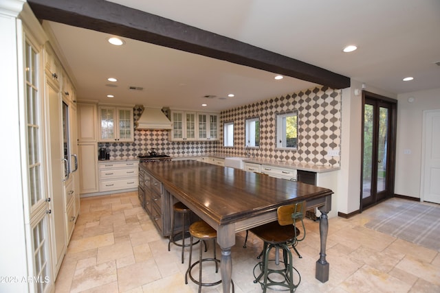 interior space featuring beam ceiling