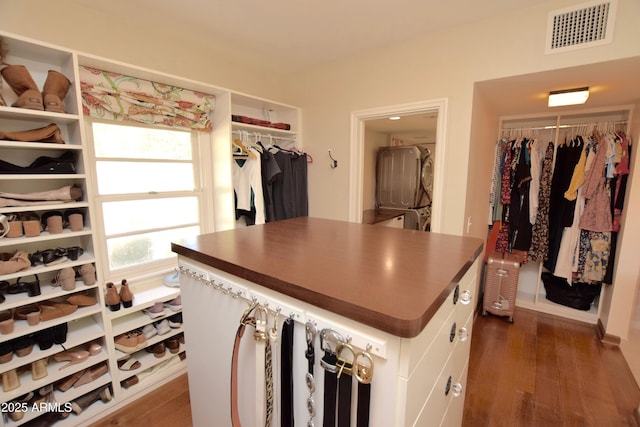 walk in closet featuring dark hardwood / wood-style flooring