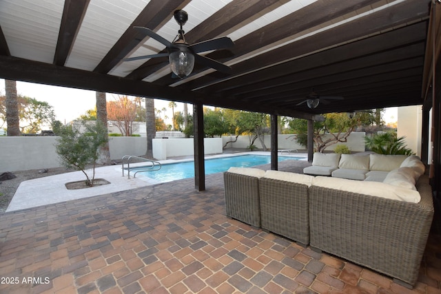 view of swimming pool featuring a patio area, ceiling fan, and an outdoor hangout area