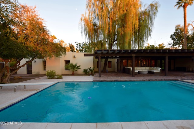 view of swimming pool featuring a pergola, a patio area, and outdoor lounge area