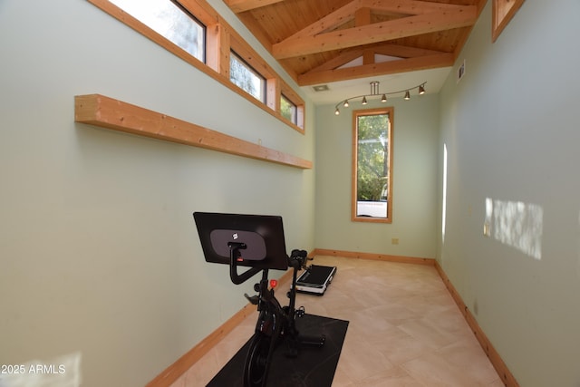 exercise area with wood ceiling and high vaulted ceiling