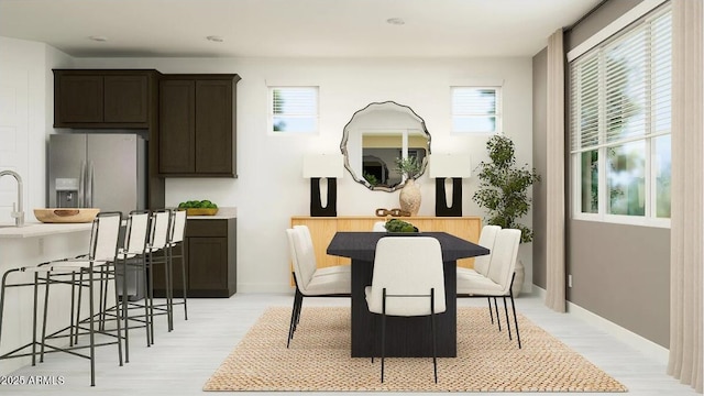 11946 W Calle De Pompas, Peoria, AZ 85383 - dining room with light wood-style flooring and baseboards