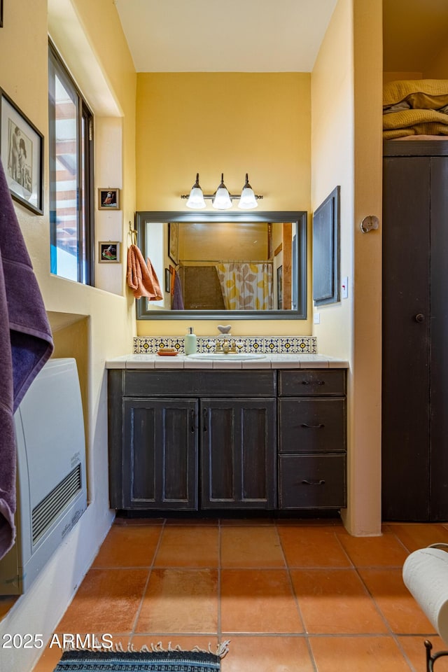 42617 Hovatter Rd, Salome, AZ 85348 - bathroom with tile patterned floors, a shower with curtain, vanity, and heating unit