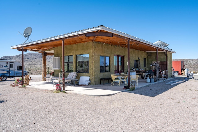 42617 Hovatter Rd, Salome, AZ 85348 - rear view of house with a patio area, metal roof, and a mountain view
