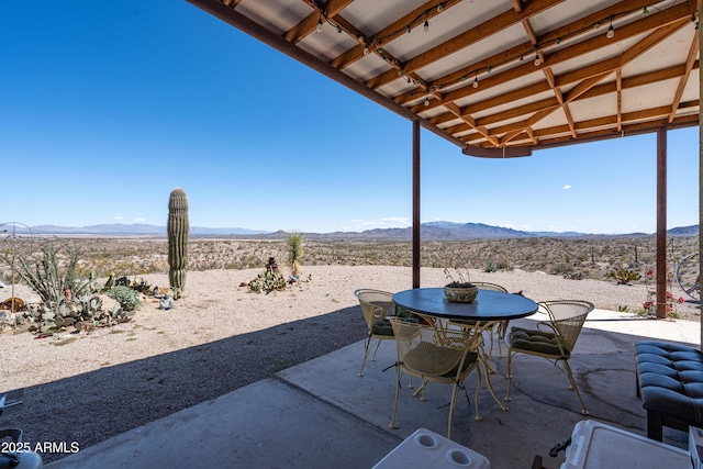 42617 Hovatter Rd, Salome, AZ 85348 - view of patio with outdoor dining area, a mountain view, and view of desert