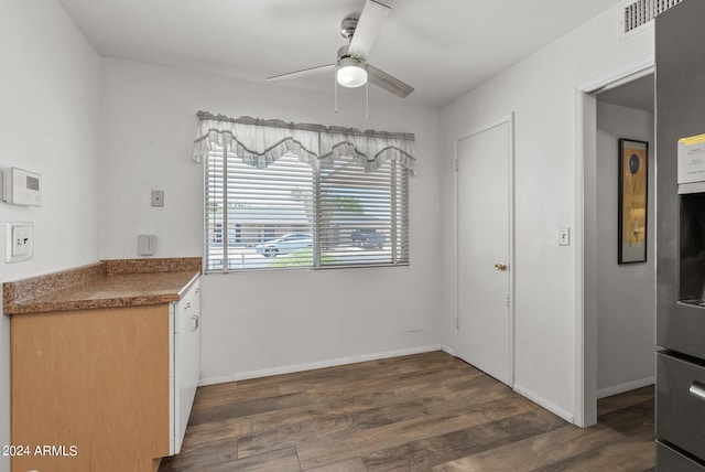 kitchen with ceiling fan and dark hardwood / wood-style flooring