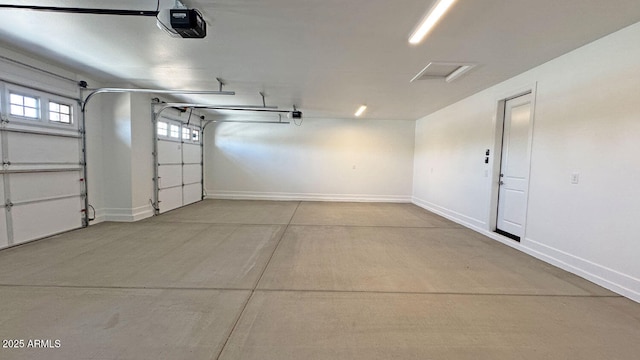 16777 W Sheila Ln, Goodyear, AZ 85395 - garage featuring a garage door opener and baseboards