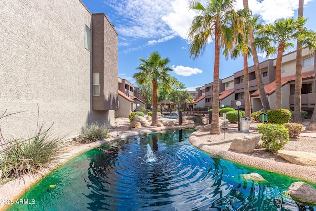 view of pool featuring a residential view