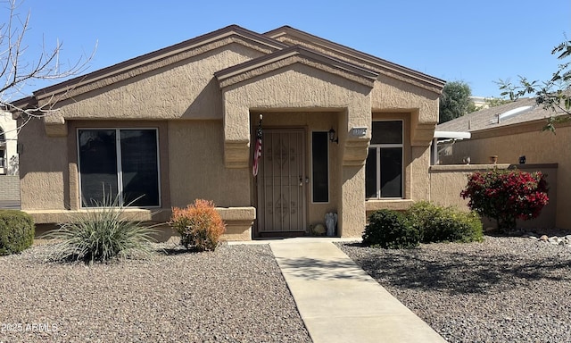 view of front of house featuring stucco siding