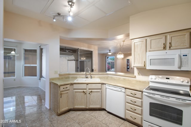 kitchen featuring ceiling fan, a sink, light brown cabinets, white appliances, and light countertops