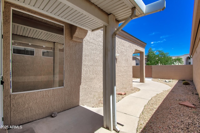 view of patio featuring fence