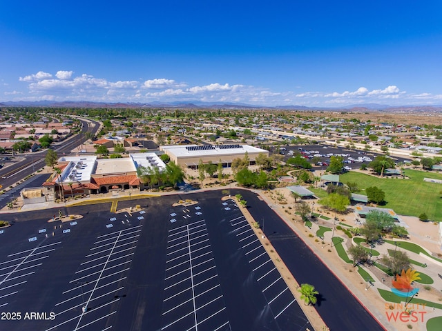 drone / aerial view featuring a residential view and a mountain view