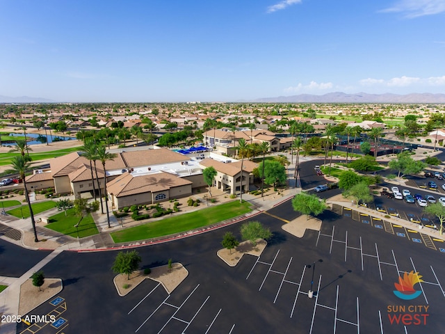 drone / aerial view featuring a residential view and a water and mountain view