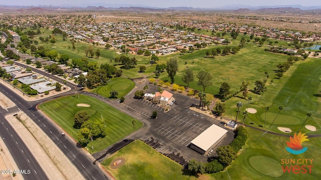 birds eye view of property featuring a residential view, a mountain view, and golf course view