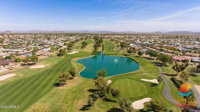 bird's eye view featuring view of golf course, a residential view, and a water and mountain view